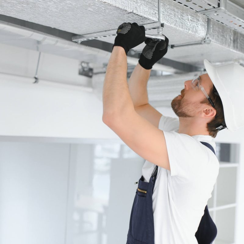 ventilation-system-installation-and-repair-service-hvac-technician-at-work-banner-copy-space.jpg